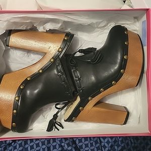 Black high heel clogs